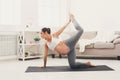 Happy pregnant woman training yoga at home Royalty Free Stock Photo