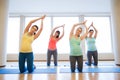 Happy pregnant women exercising on mats in gym Royalty Free Stock Photo
