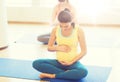 Happy pregnant women exercising yoga in gym Royalty Free Stock Photo