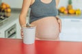 Happy pregnant young woman eating ice cream Royalty Free Stock Photo