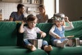 Happy preschool cute girl and boy playing with kitchenware toget Royalty Free Stock Photo