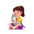 Happy preschool girl kid embracing and patting cat Royalty Free Stock Photo