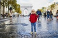 Happy preschooler girl walking in Champs-Elysees in Paris, France Royalty Free Stock Photo