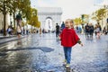 Happy preschooler girl walking in Champs-Elysees in Paris, France Royalty Free Stock Photo