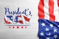 Happy President`s Day - federal holiday. American flag and text on white wooden background, top view Royalty Free Stock Photo