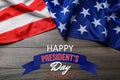 Happy President`s Day - federal holiday. American flag and text on wooden background, top view Royalty Free Stock Photo