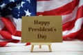 Happy President`s Day text message with USA flag on wooden background Royalty Free Stock Photo