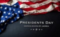 Happy presidents day concept with flag of the United States on black wooden background