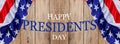 Happy Presidents` Day text on wooden with flag of the United States Border