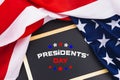 Happy Presidents` Day typography over blackboard background with US American flag border Royalty Free Stock Photo