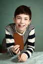 Happy preteen boy with chocolate bar Royalty Free Stock Photo