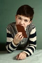 Happy preteen boy with chocolate bar Royalty Free Stock Photo