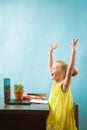 Happy preteen child in delight learn lessons at home on quarantine Royalty Free Stock Photo