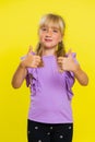 Happy preteen child girl kid looking approvingly at camera showing thumbs up, like positive sign Royalty Free Stock Photo