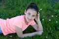 Happy preteen girl lying in the grass Royalty Free Stock Photo