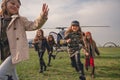 Happy preteen girls running on flying field of aeroclub Royalty Free Stock Photo