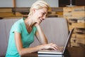 Happy pretty blonde using computer Royalty Free Stock Photo