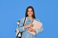 Happy gen z Latin girl student with backpack isolated on blue background. Royalty Free Stock Photo