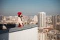 Happy pretty lady talking on mobile phone on roof Royalty Free Stock Photo