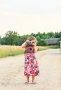 Happy Cute  little girl in retro outfit taking pictures with old film camera Royalty Free Stock Photo