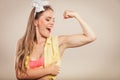 Happy pretty pin up girl showing off muscles. Royalty Free Stock Photo