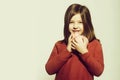 Happy, pretty, small, little girl smiling and cuddling piggy bank