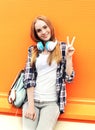 Happy pretty smiling girl with headphones listens to music Royalty Free Stock Photo