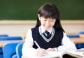 Happy pretty student girl with books in classroom Royalty Free Stock Photo