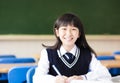 Happy pretty student girl with books in classroom Royalty Free Stock Photo