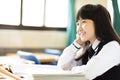 Happy pretty student girl with books in classroom Royalty Free Stock Photo