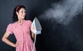 happy pretty woman with brunette hair use steaming iron, laundry Royalty Free Stock Photo