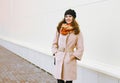 Happy pretty woman in coat