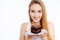 Happy pretty woman holding piece of chocolate cake on plate Royalty Free Stock Photo