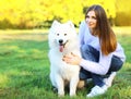 Happy pretty woman owner and dog outdoors Royalty Free Stock Photo