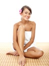 Happy Pretty Woman Sitting on Floor at the Spa Royalty Free Stock Photo