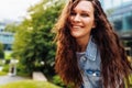 Happy pretty young redhead woman with long curly hair Royalty Free Stock Photo