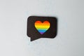 Happy Pride month banner for lgbt rights or social issues event. Colorful rainbow heart in black social media interaction cloud,