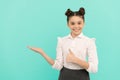 Happy primary school girl give thumbs up showing open hand gesture back to school sale, shopping Royalty Free Stock Photo