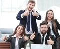 Happy professional business team showing thumbs up Royalty Free Stock Photo