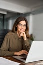 Happy professional business woman of middle age with laptop in office, portrait. Royalty Free Stock Photo