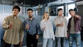 Happy professional confident group diverse people corporate employees standing in row looking at camera smiling showing Royalty Free Stock Photo