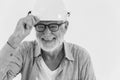 Happy worker, dprofessional healthy elder worker portrait of smiling senior engineer work man black and white monotone