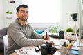 Portrait of a smiling latin man working as a photographer