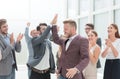 happy project Manager accepting congratulations of his colleagues Royalty Free Stock Photo