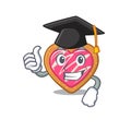 Happy and proud of cookie heart wearing a black Graduation hat Royalty Free Stock Photo