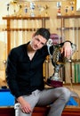 Happy proud winner man with big trophy silver cup Royalty Free Stock Photo