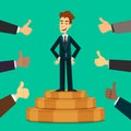 Happy and proud young businessman or manager on the podium with many thumbs up hands around him. Business compliment Royalty Free Stock Photo