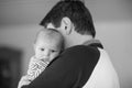 Happy proud young father with newborn baby daughter, family portrait togehter Royalty Free Stock Photo