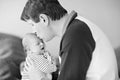 Happy proud young father having fun with newborn baby daughter, family portrait togehter. Dad with baby girl, love. New Royalty Free Stock Photo