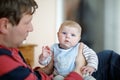 Happy proud young father with newborn baby daughter, family portrait togehter Royalty Free Stock Photo